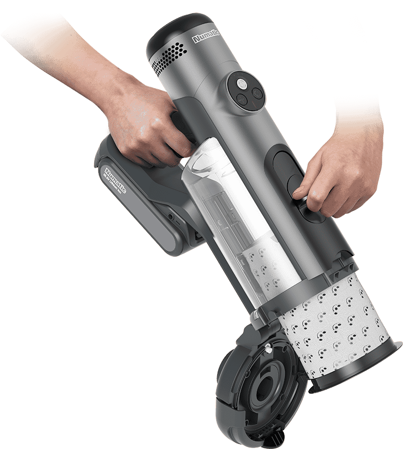 numatic quick main qui retire la capsule de l'aspirateur à balai